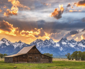 This digitally printed cotton fabric panel features the Grand Tetons in Wyoming with the iconic Moulton Barn beneath a beautifil sunset.