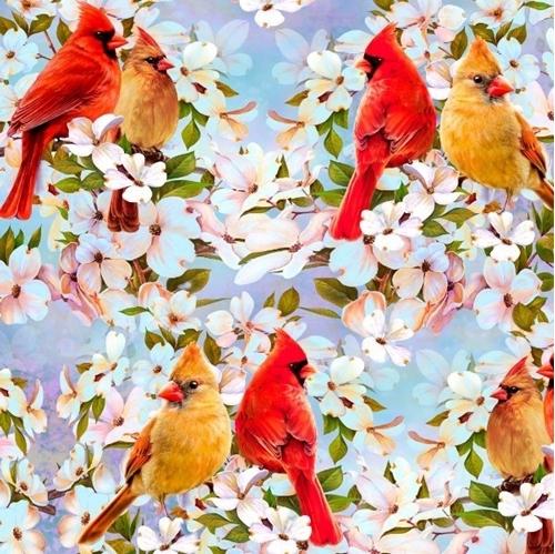 This cotton fabric features a pair of cardinals sitting on the branches of trees blooming with pastel pink and white dogwood flowers.