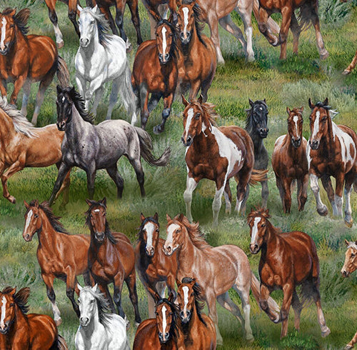 This cotton fabric features wild horses running through a green meadow. Available at Colorado Creations Quilting