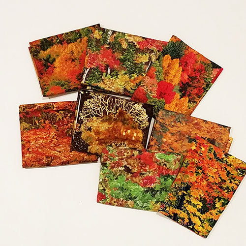 This cotton fat quarter bundle has a selection of trees with autumn-colored leaves in rich red, orange and gold.