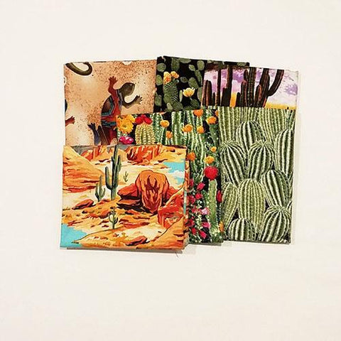 This bundle of cotton fat quarters has a selection of images including cacti and blooming flowers, sunsets, wildlife and mountains. 