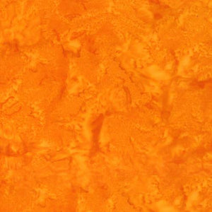 Mottled Squash Orange Batik Cotton Fabric available at Colorado Creations Quilting