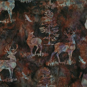 This batik cotton fabric features deer and buck on a darker brown background. Available at Colorado Creations Quilting