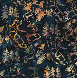 This fabric features moose, elk, bears, wolves, pheasants and evergreen trees in tan tones stamped on a navy background custom batik print by Hoffman Fabrics.