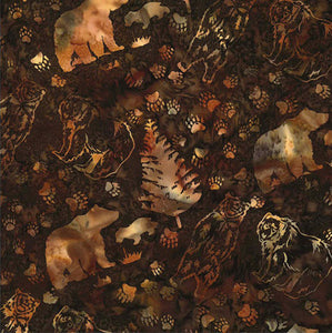 Light brown images of bears, evergreens, and paw prints are stamped on a rich bourbon brown background by Hoffman Fabrics
