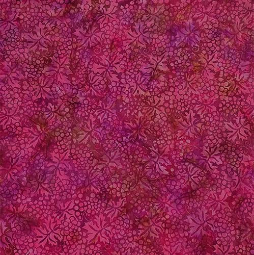 This batik  cotton fabric features red grapes and leaves available at Colorado Creations Quilting