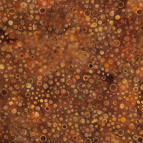  This batik cotton fabric features dots in rich copper tones. Available at Colorado Creations Quilting