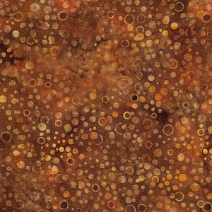  This batik cotton fabric features dots in rich copper tones. Available at Colorado Creations Quilting