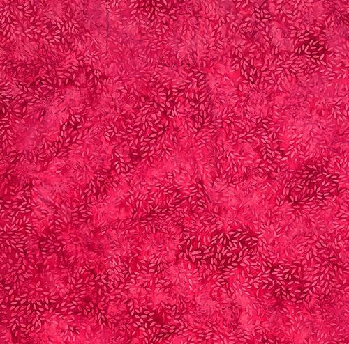 This dark pink tonal fabric shows tossed seeds or rice images by Island Batiks. Available at Colorado Creations Quilting
