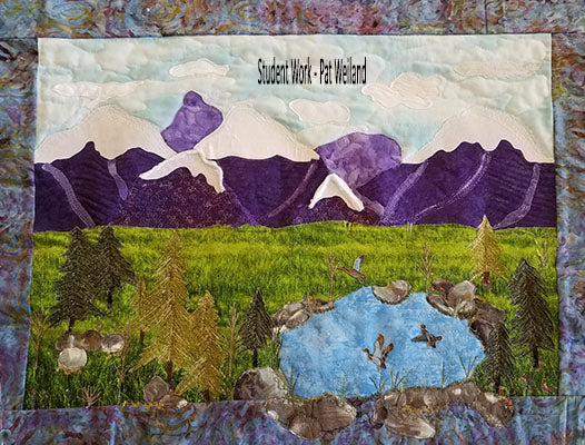 Purple mountain scene with a river flowing into the lake below.  Improv Landscape quilt pattern by Jackie Vujcich of Colorado Creations Quilting