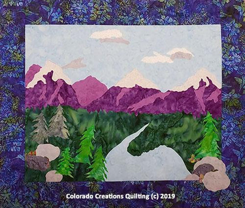 Purple mountain scene with a river flowing into the lake below.  Improv Landscape quilt pattern by Jackie Vujcich of Colorado Creations Quilting