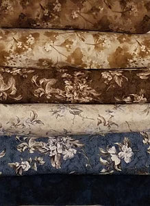 A 6-Pack is six coordinated half-yard pieces of fabric. This particular kit is called Denim. It includes various shades of blue and brown fabric.