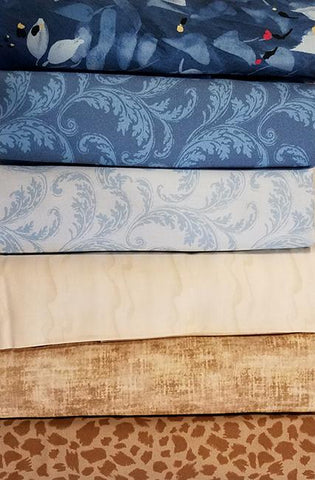 A 6-Pack is six coordinated half-yard pieces of fabric. This particular kit is called Feelin' Blue . It includes blue and tan fabric.
