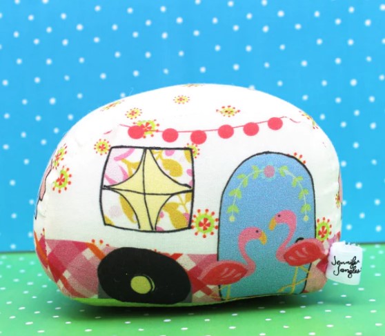 This adorable pin cushion, in the form of a vintage camping trailer with flamingo lawn decorations is sure to put a smile on your face!