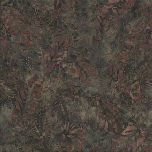 This batik tonal fabric features leaves on an dark brown background. 