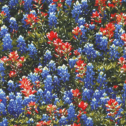 This cotton fabric features red fireweed, and bluebonnet wildflowers on a field of green and is available at Colorado Creations Quilting