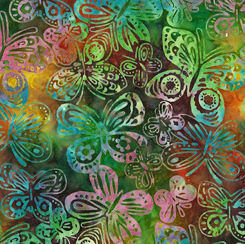 This batik fabric features butterflies on a vibrant rainbow-colored background.
