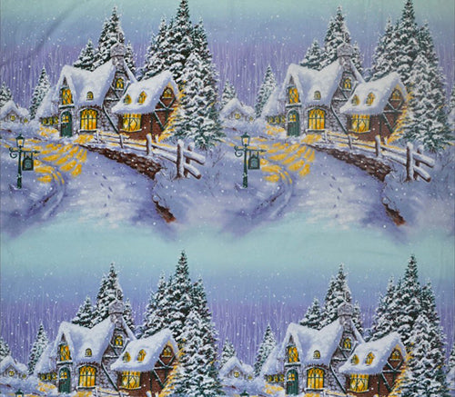 This fabric panel features small village country houses along a snow-covered lane aglow with candlelight from within.