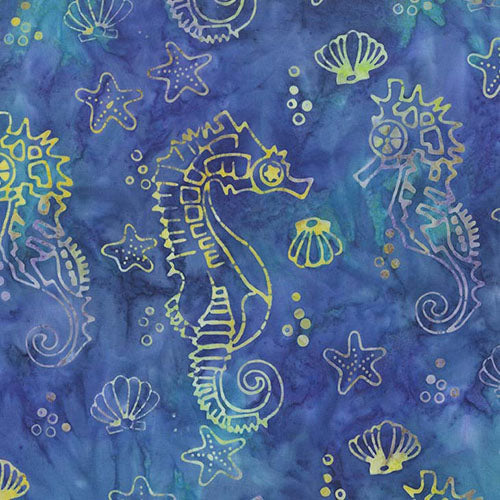 This batik fabric features seahorses along with starfish and other seashells on a rich blue background.  
