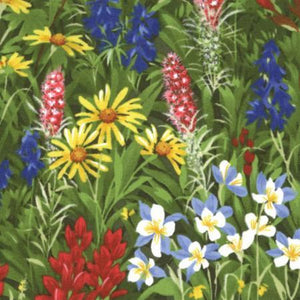 multi-colored wildflowers on green grass fabric available at Colorado Creations Quilting