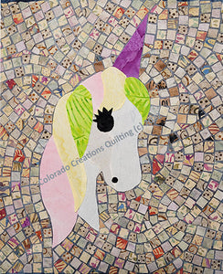 This art quilt pattern features a unicorn with pink, yellow and green mane and a purple horn in the mosaic style