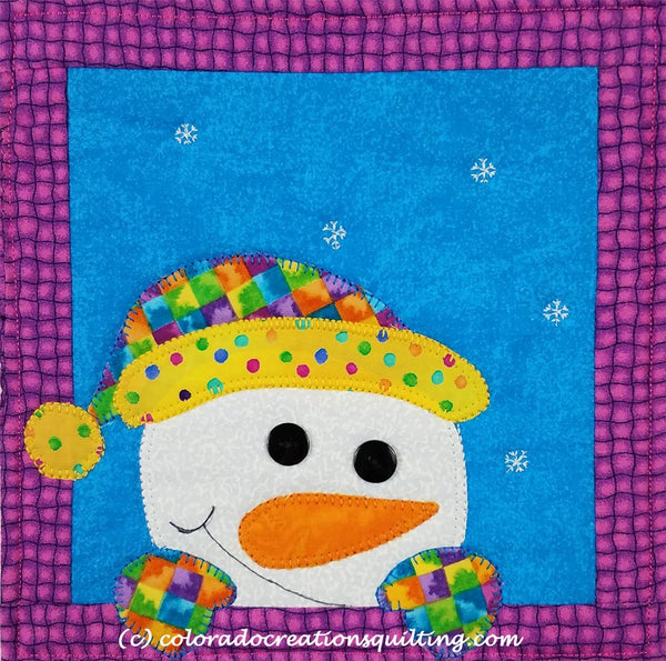 Snowman appliqued on a quilted square to hold your coffee cup