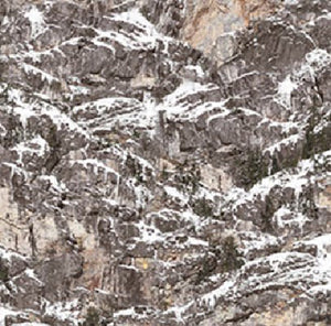 This digitally printed cotton fabric features textured brown rocks covered with snow. 
