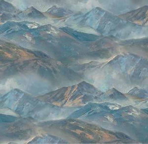 This cotton quilting fabric features bluish mountain ranges