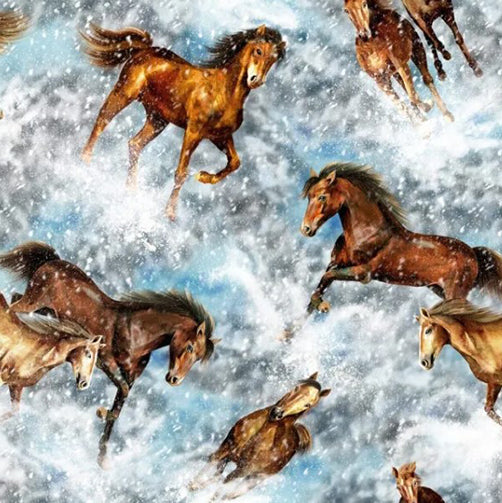 This cotton fabric features wild stallions galloping and kicking up snow.  