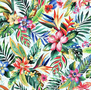 This cotton fabric features brightly-colored images of tropical flowers such as hibiscus, bird of paradise and plumeria on a light blue background. Available at Colorado Creations Quilting 