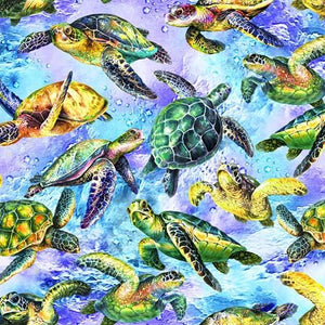 This cotton fabric features sea turtles on a rich blue background. Available at Colorado Creations Quilting
