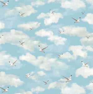 Serene seagulls are featured on a light blue sky with white puffy clouds. Available at Colorado Creations Quilting