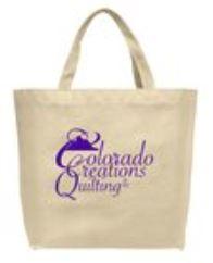 Natural colored tote bag with a purple mountain image from Colordo Creations Quilting.  Join the club!