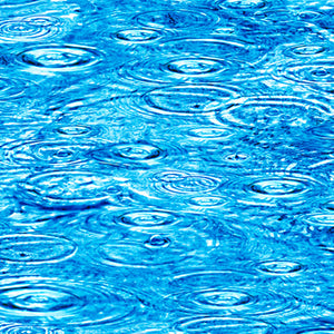 This fabric featuring rain droplets on bright blue water and making ripples
 available at Colorado Creations Quilting