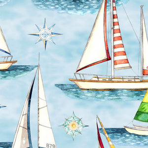 Brightly colored sailboats on blue water fabric