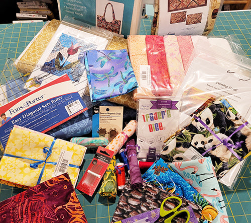 A quilter's dream items are featured such as fabric, patterns, kits, notions.  Available at Colorado Creations Quilting