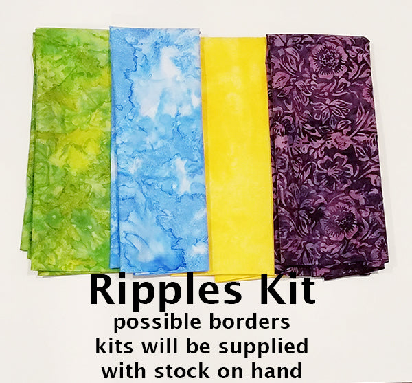 The Ripples quilt kit has  border fabrics such as these in green, blue, yellow and purple. 