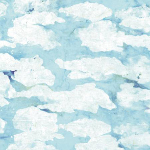 This batik fabric features a blue sky with white billowing clouds floating in the breeze.
