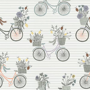 This cotton fabric features darling bikes in shades of gray and peach all carrying a basket of flowers on a sage green background.