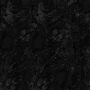 This batik fabric features black texture.