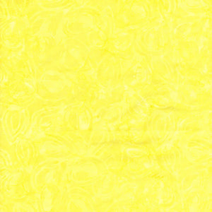 This yellow batik cotton fabric features subtle swirls 
