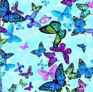 Brightly-colored butterflies on a blue background are featured on this cotton fabric