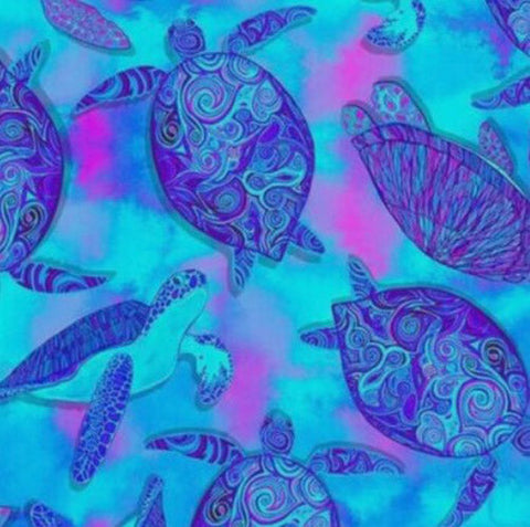 This cotton fabric features blue sea turtles with unique markings on their shells on an aqua background which really makes it look as though they're swimming at night.