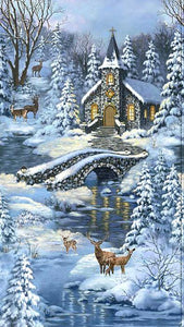 This cotton fabric panel features a snow-covered church in the middle of a winter forest.   The golden glow is relected in the river that runs under the rock bridge. Forest wildlife such as deer can be seenthrought the scene. 