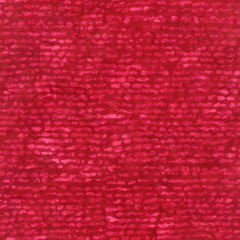 This batik fabric features red stripes.