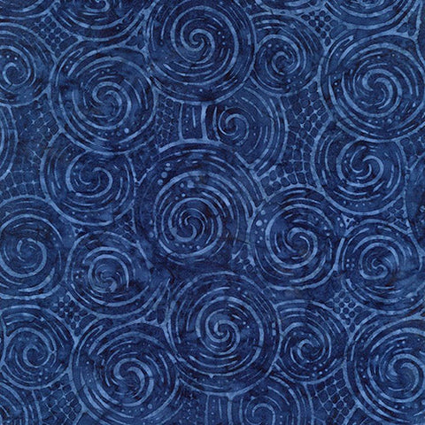 This tonal batik fabric features navy blue circles.
