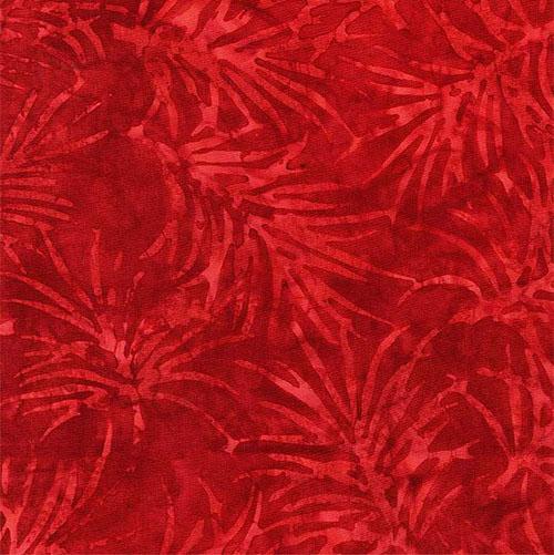 This fire engine red batik cotton fabric features large spiky flowers