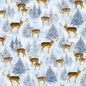 This cotton fabric features small deer among snow-covered evergreen trees in shades of blue and gray. 
