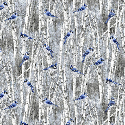 This cotton fabric features blue jays among snowy winter trees