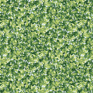 This cotton fabric features small green leaves